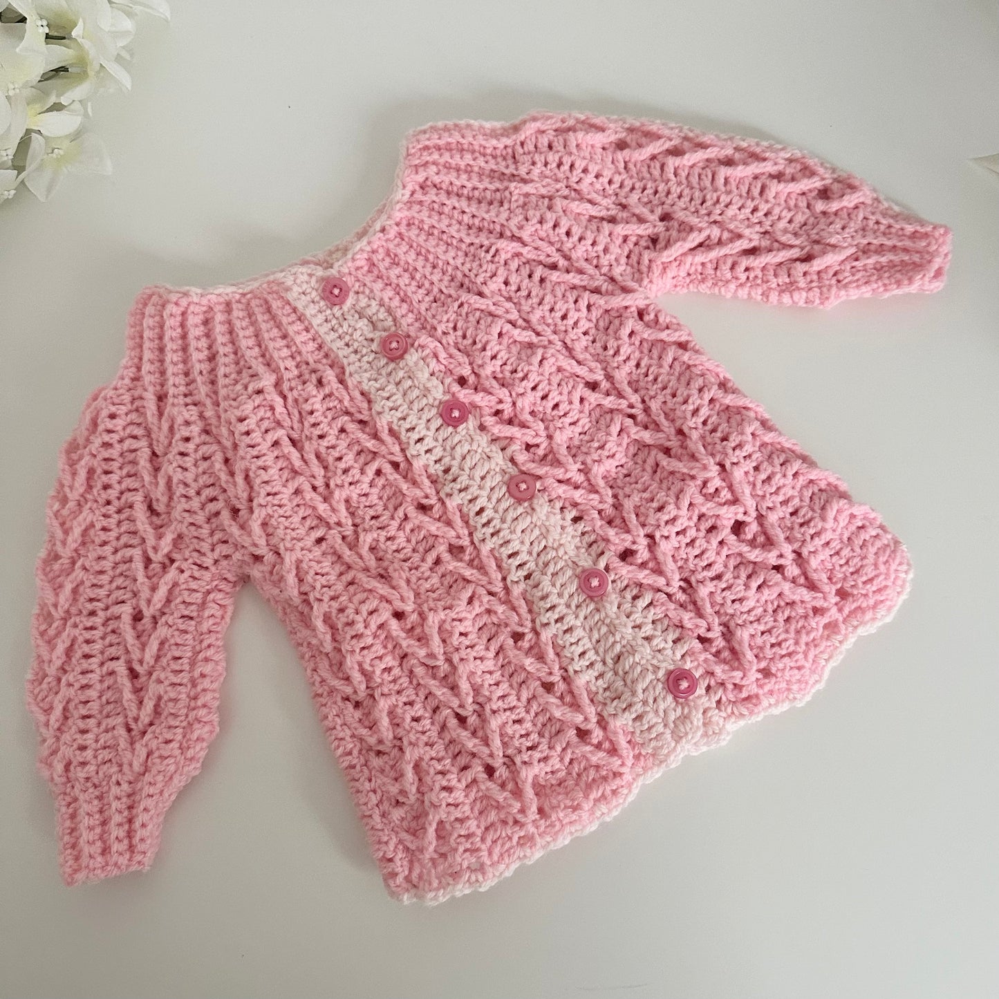 Gilet en crochet rose